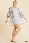 white tunic dress with lace and flowers