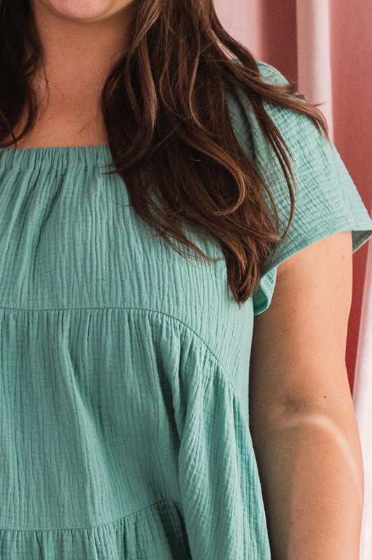 green short sleeve tiered babydoll dress All There Boutique green short sleeve tiered babydoll dress All There Boutique